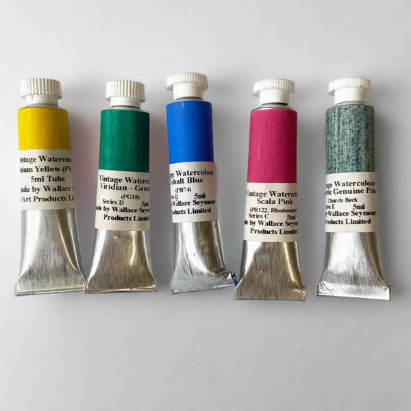 a selection of 5 Wallace and Seymour Watercolour paints in 5ml tubes on a white background