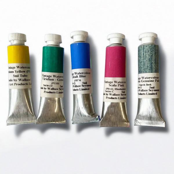 a selection of Wallace and Seymour watercolour paints in 5ml tubes on a white background
